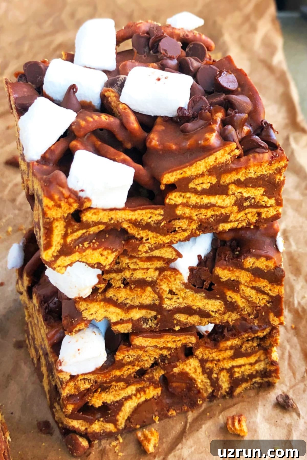 Stack of Easy No Bake Smores Bars on Brown Parchment Paper.