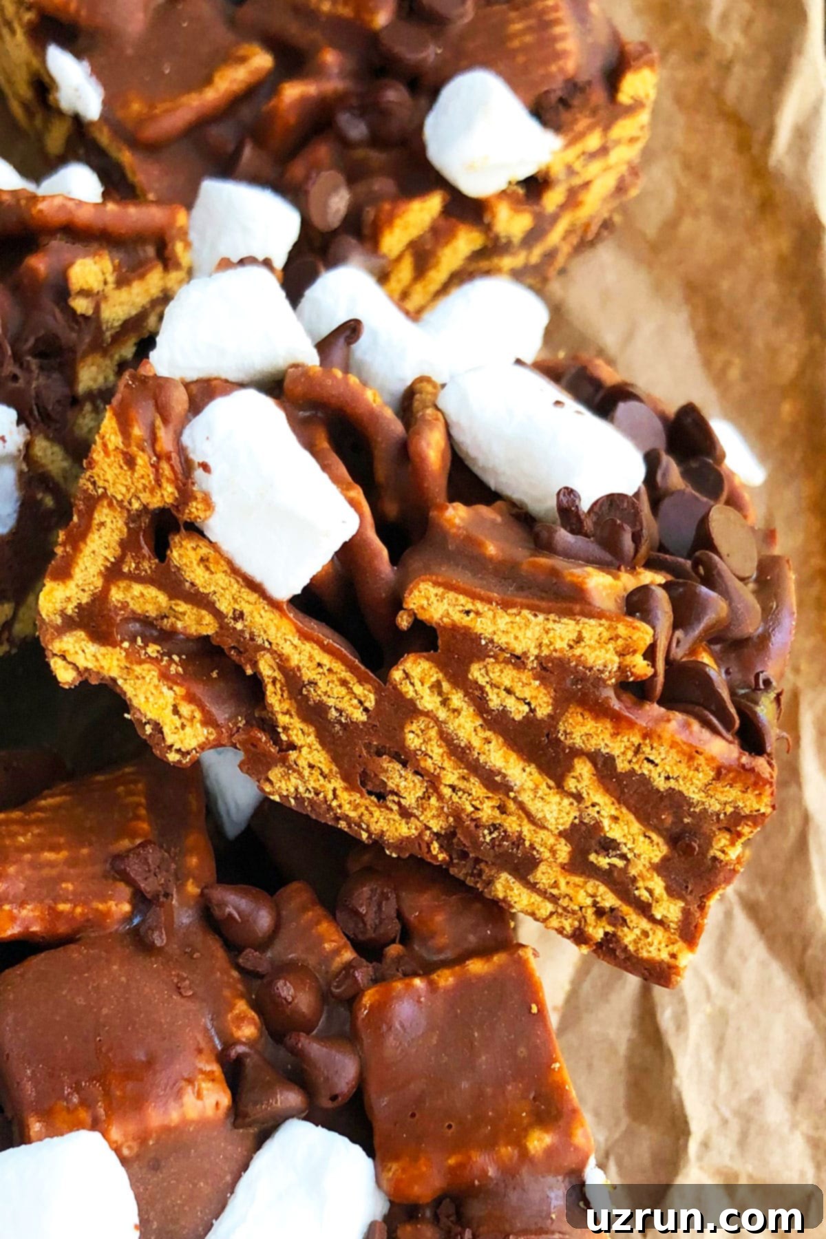 Easy No Bake Smores Bars 3 Closeup Shot of Chocolate, Marshmallows and Graham Cereal Bars.