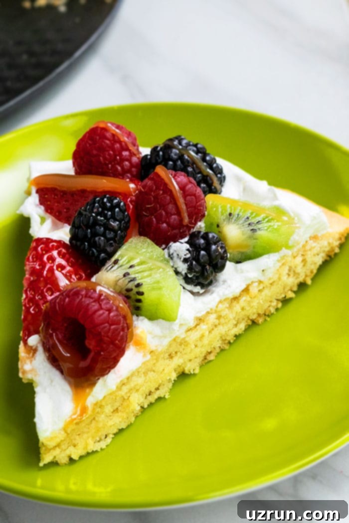 Effortless 30-Minute Fruit Pizza 3 Homemade Fruit Pizza Cookie Slice on Green Plate