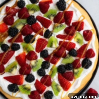 Effortless 30-Minute Fruit Pizza 5 Easy Sugar Cookie Fruit Pizza on Black Plate