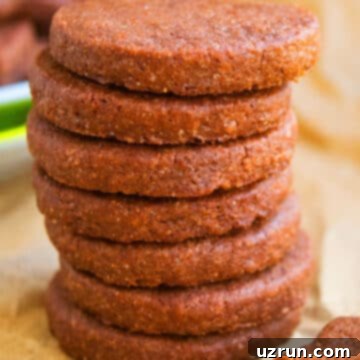 Easy Cut-Out Chocolate Sugar Cookies 5 Stack of Easy Cut Out Chocolate Sugar Cookies on Sheet of Brown Parchment Paper.