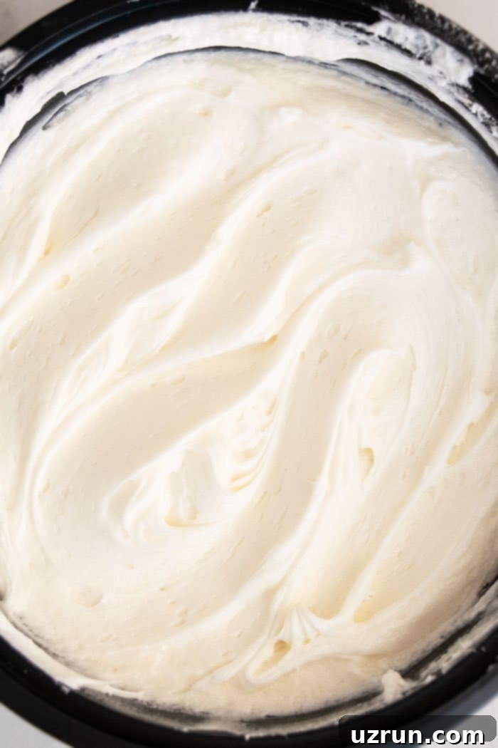 Classic Cinnamon Roll Glaze 3 Easy Cinnamon Roll Frosting in Black Bowl