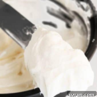 Classic Cinnamon Roll Glaze 4 Best Cinnamon Roll Icing Without Cream Cheese in Black Bowl