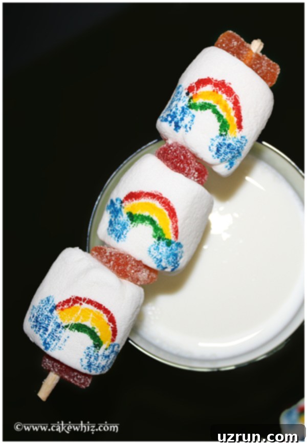 Easy Marshmallow Pops for Any Holiday 4 Rainbow Marshmallow Pops on Black Background