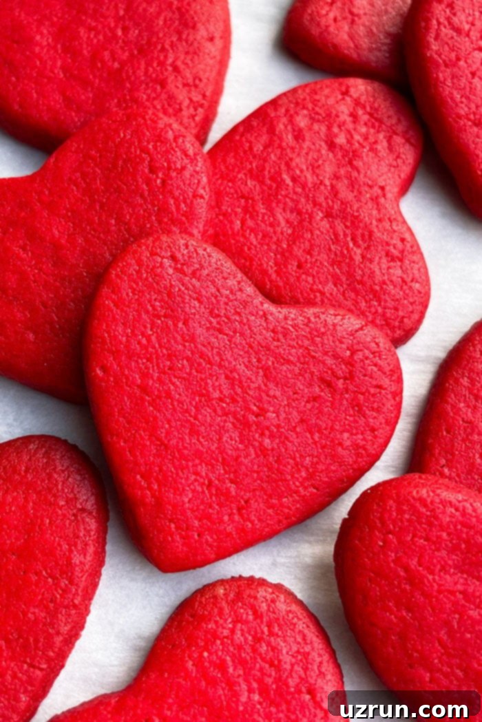 Red Velvet Heart Cookies Placed on Sheet of Parchment Paper
