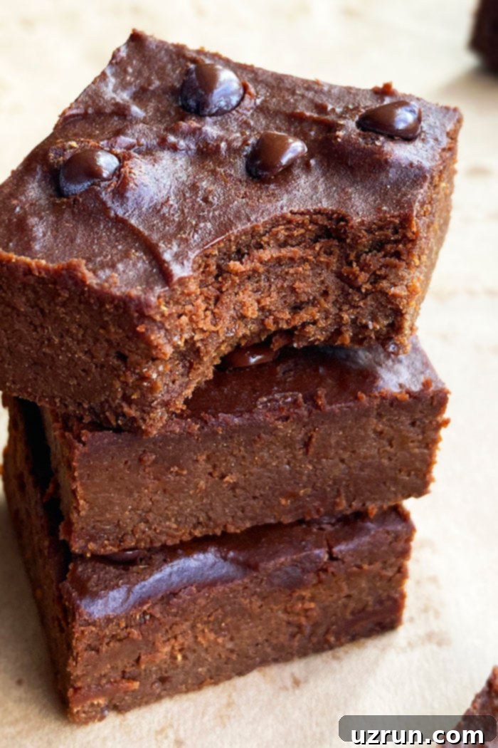 Semi-Homemade Pumpkin Brownies 3 Stack of Homemade Pumpkin Brownies With a Partial Bite Removed