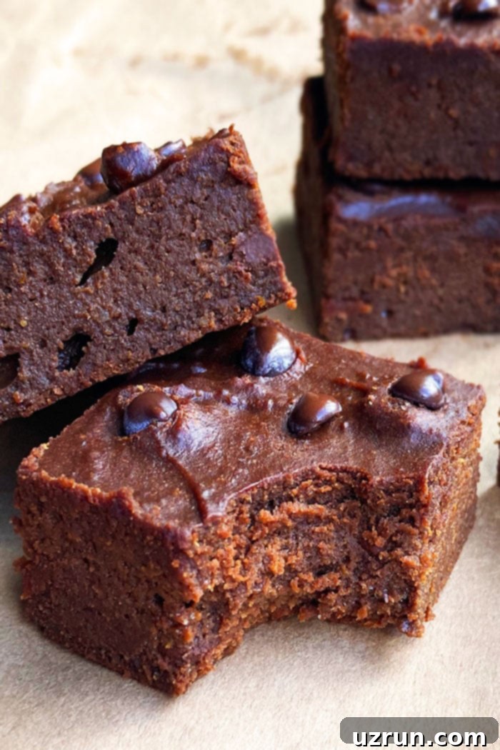 Semi-Homemade Pumpkin Brownies 4 Closeup Shot of Best Doctored Brownies with Brownie Mix and Canned Pumpkin on Brown Sheet