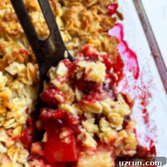 Apple Cranberry Crisp 6 Easy Apple Cranberry Crisp in Glass Dish on White Background