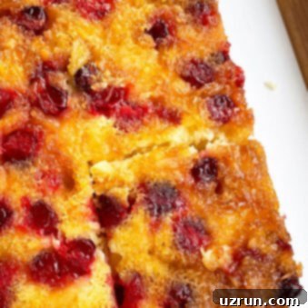 Quick and Easy Cranberry Upside Down Cake 7 Easy Cranberry Upside Down Cake with Cake Mix on White Dish- Overhead Shot