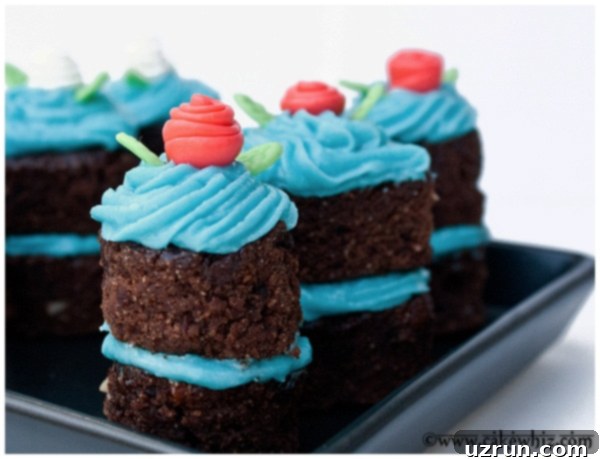 Crafting Simple Fondant Ribbon Roses 4 Mini Fondant Flowers on Mini Chocolate Cakes in Black Plate