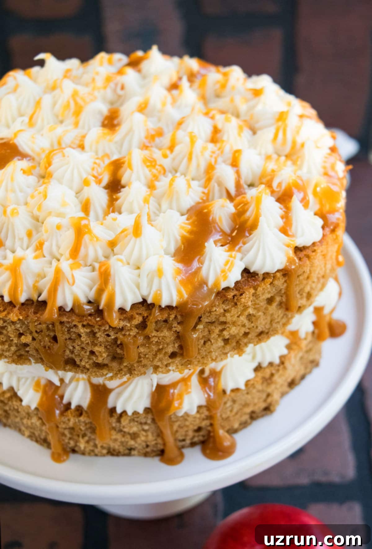 Easy Applesauce Cake 3 Closeup Shot of Cream Cheese Frosting and Caramel Sauce on Top of Cake