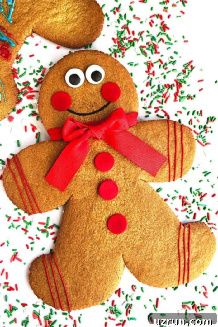 Jumbo Gingerbread Men Cookies on White Background With Sprinkles Scattered Everywhere