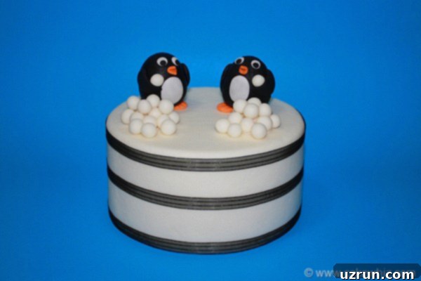 Effortless Penguin Cake with Silky Buttercream 6 Winter Cake on Blue Background