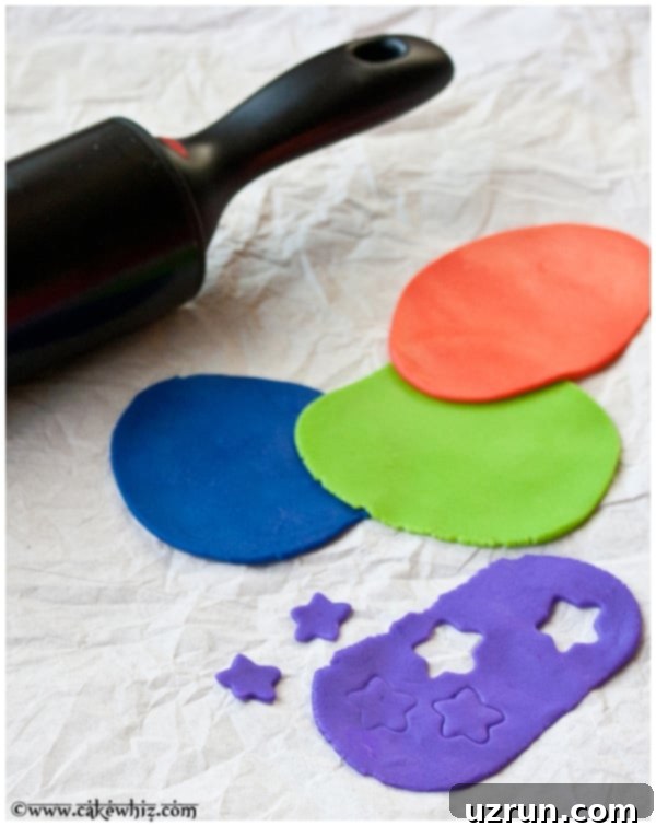 Easy Homemade Marshmallow Fondant in Different Colors on Dull Gray Background