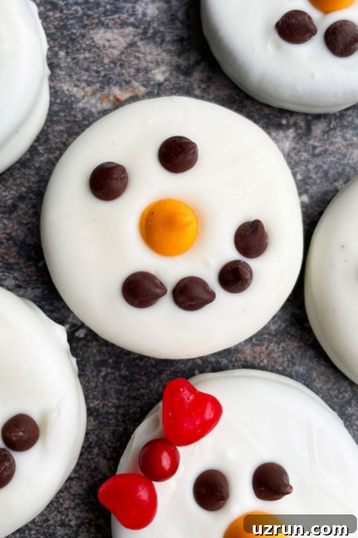 Festive Oreo Snowmen 5 Chocolate Dipped Oreos on Rustic Gray Background