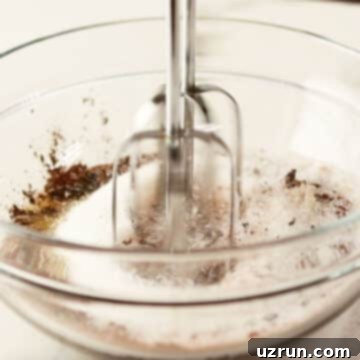 Dark Chocolate Cherry Fudge Brownies 5 Ingredients being mixed in glass bowl.