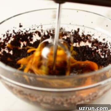 Dark Chocolate Cherry Fudge Brownies 7 Brownie batter being mixed in a glass bowl.