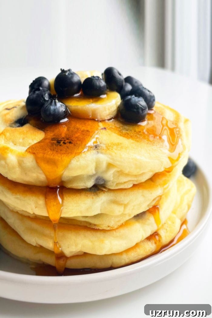 Perfectly Fluffy Lemon Blueberry Pancakes 4 Stack of Best Fluffy Pancakes With Blueberries on White Plate