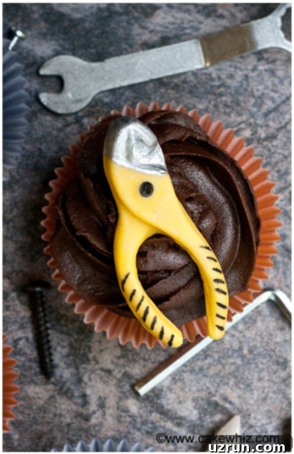 Dad's Tool Belt Cupcakes: A Father's Day Treat 3 Decorated Fathers Day Cupcakes With Edible Handyman Tools on Rustic Gray Background