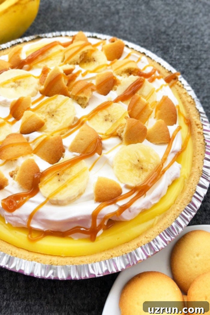 Easy No Bake Banana Cream Pie on Gray Background