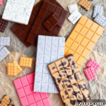Craft Your Own Chocolate Bars Dark Milk and White Flavors 8 Easy Homemade Chocolate Bars (Dark, Milk, White) on Brown Parchment Paper.