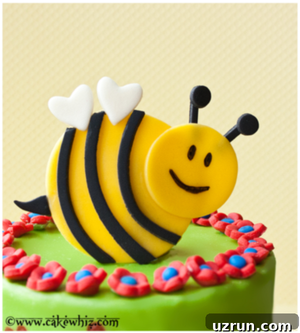 Spring Bumblebee Cake 4 Closeup Shot of Fondant Bumblebee Topper With Yellow Background.