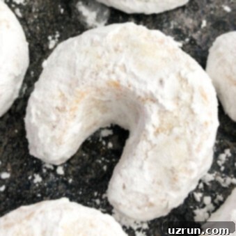 Almond Crescent Cookies 5 Classic Almond Crescent Cookies (Vanillekipferl) on Grayish Black Background- Overhead Shot
