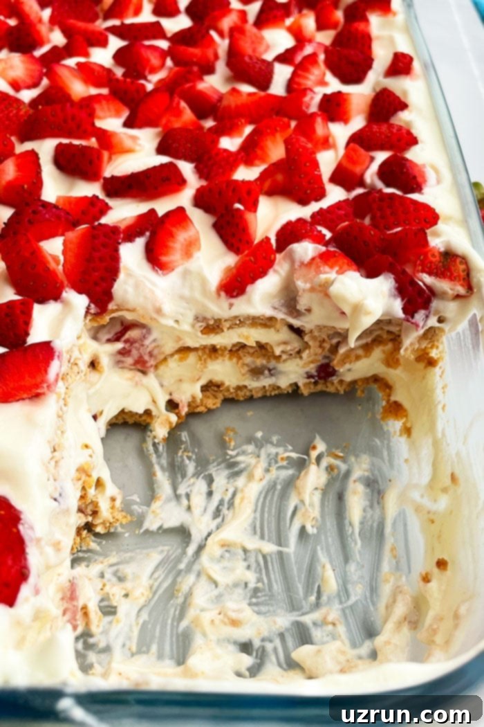 Effortless No-Bake Strawberry Icebox Cake 3 Classic Refrigerated No Bake Graham Cracker Cake With Pudding and Cool Whip and Strawberries- Closeup Shot