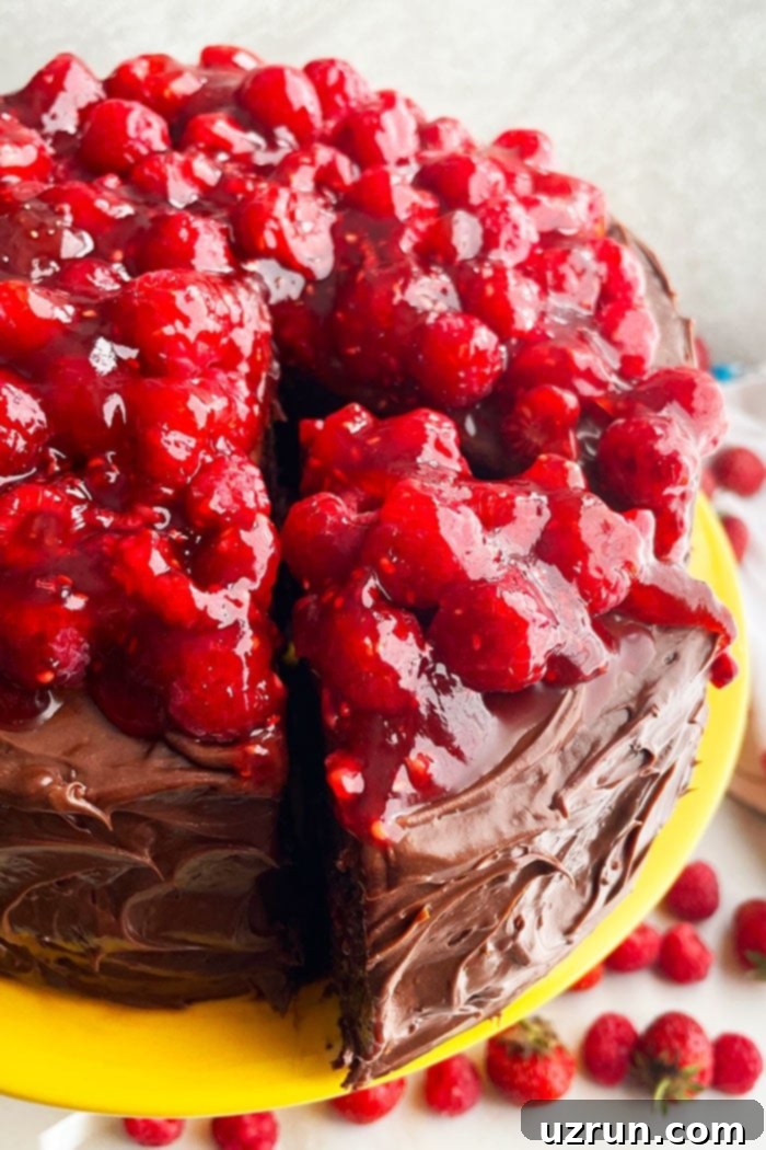 Luscious Chocolate Raspberry Cake Made Easy 3 Summer Chocolate Raspberry Cake on Cake Stand With One Slice Cut Out