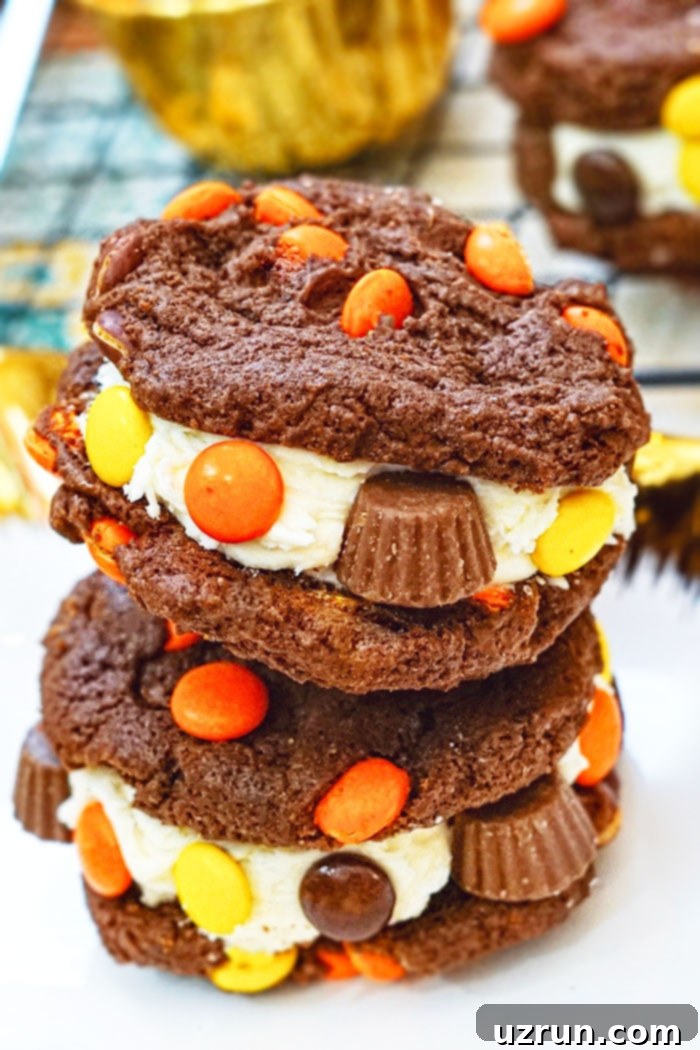 Easy Reeses Cake Mix Cookies 4 Stack of Reeses Peanut Butter Cookies Sandwiches With Buttercream Icing on White Plate