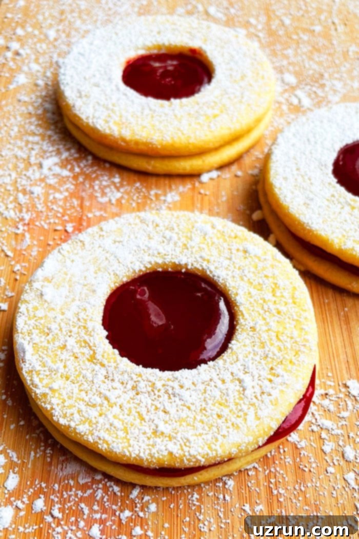 Easy Linzer Cookies With Raspberry Jam on Wood Background