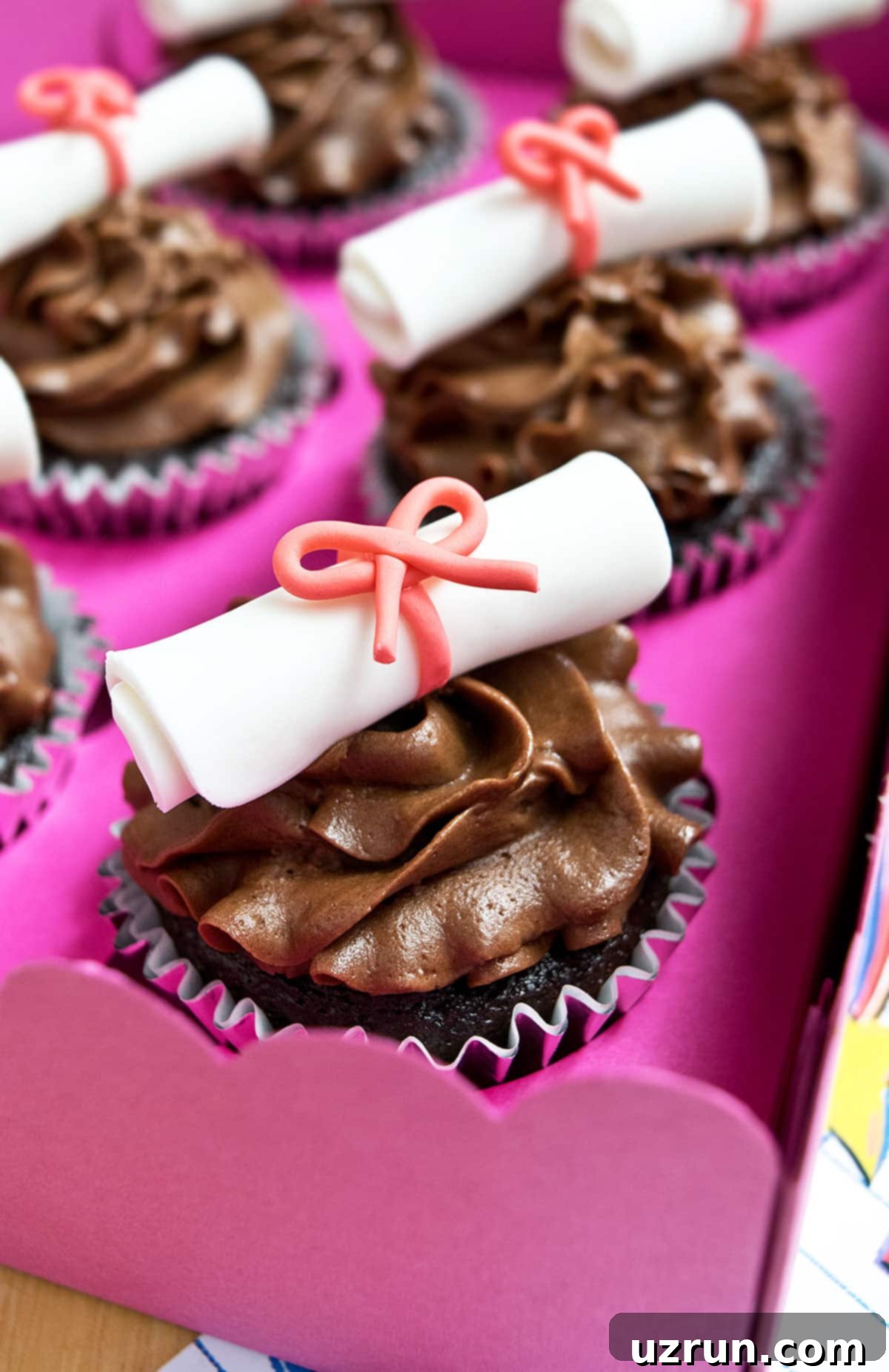 Easy Graduation Cupcakes with Diploma Toppers 6 Decorated Cupcakes in a Pink Box.