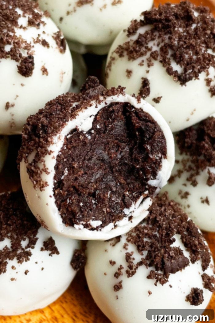 Oreo Truffles 3 Closeup shot of partially eaten No-Bake Oreo Truffles in a charming Brown Plate, showcasing their delicious texture.