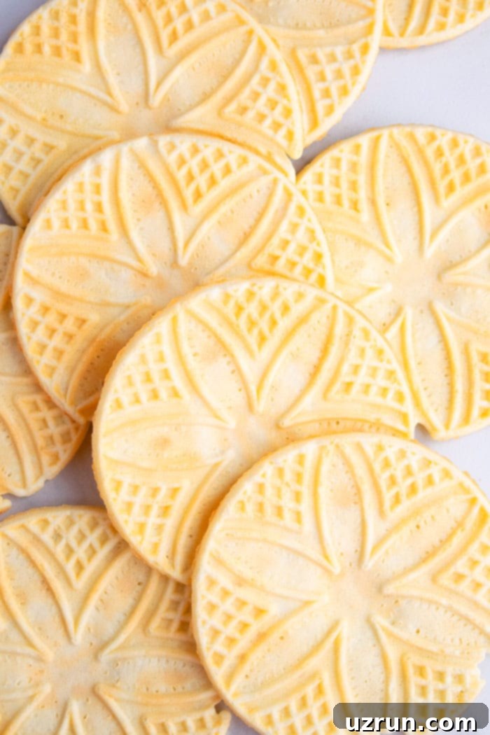 Closeup Shot of Lots of Italian Pizzelle Cookies on White Background