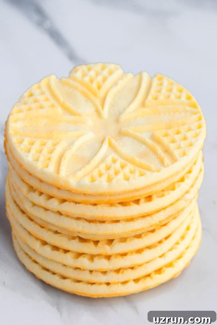 Thin and Crispy Pizzelle Cookies 3 Stack of Italian Anise Cookies on White Background