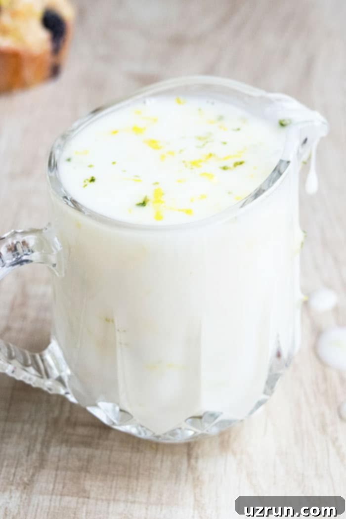Easy Lemon Glaze in Glass Cup on Rustic Wood Background