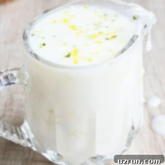 Bright Lemon Cake Glaze 3 Easy Lemon Glaze or Lemon Drizzle Icing in Glass Cup on Rustic Wood Background