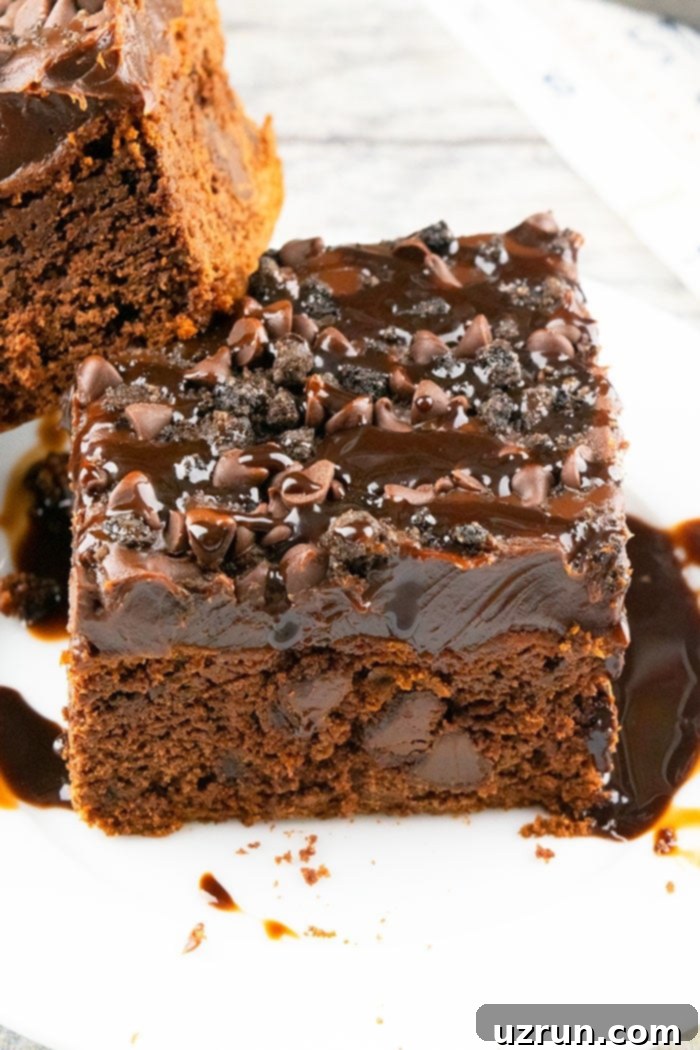 Simple Coca Cola Cake from a Box Mix 4 Slice of Chocolate Cola Cake With Chocolate Ganache Frosting on White Plate