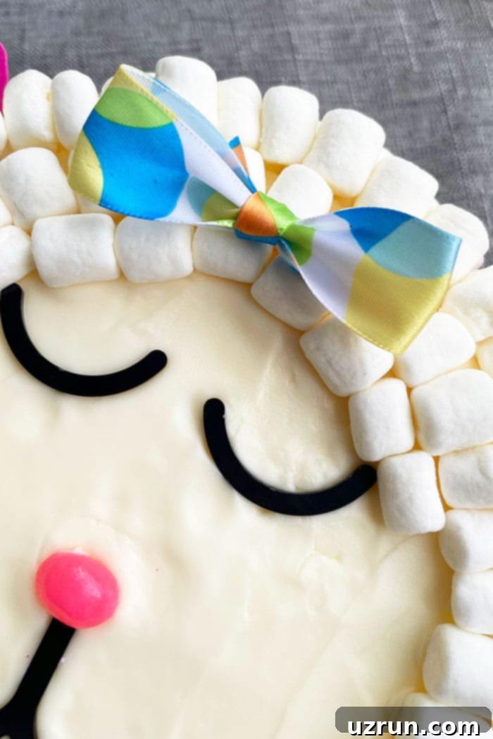 Easy Marshmallow Lamb Cake 4 Closeup Shot of Bow on Top of Cake