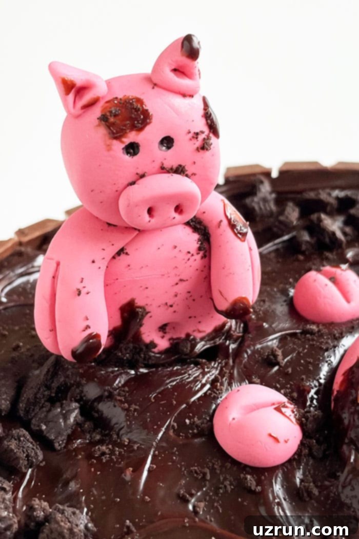 Effortless Piglet Cake 3 Easy Edible Pig Cake Topper Sitting in Ganache Mud, made from pink fondant