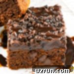 Cake Mix Desserts Made Easy 11 Slice of Cake Mix Coca Cola Cake (Coke Cake) With Chocolate Ganache Frosting on White Plate