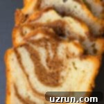 Cake Mix Desserts Made Easy 26 Slice of Easy Cinnamon Roll Cake With Cake Mix on Gray Background.