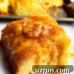 Cake Mix Desserts Made Easy 30 Slice of Easy Caramelized Banana Upside Down Cake on White Plate