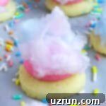 Cake Mix Desserts Made Easy 53 Easy Cotton Candy Cookies on White Marble Background With Sprinkles.