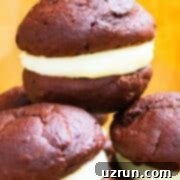 Cake Mix Desserts Made Easy 65 Stack of Easy Chocolate Whoopie Pies With Marshmallow Filling on Yellow Background.
