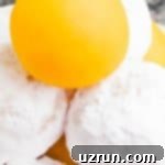 Cake Mix Desserts Made Easy 72 Tower of Lemon Cake Balls or Cake Truffles- Some Coated in Powdered Sugar.