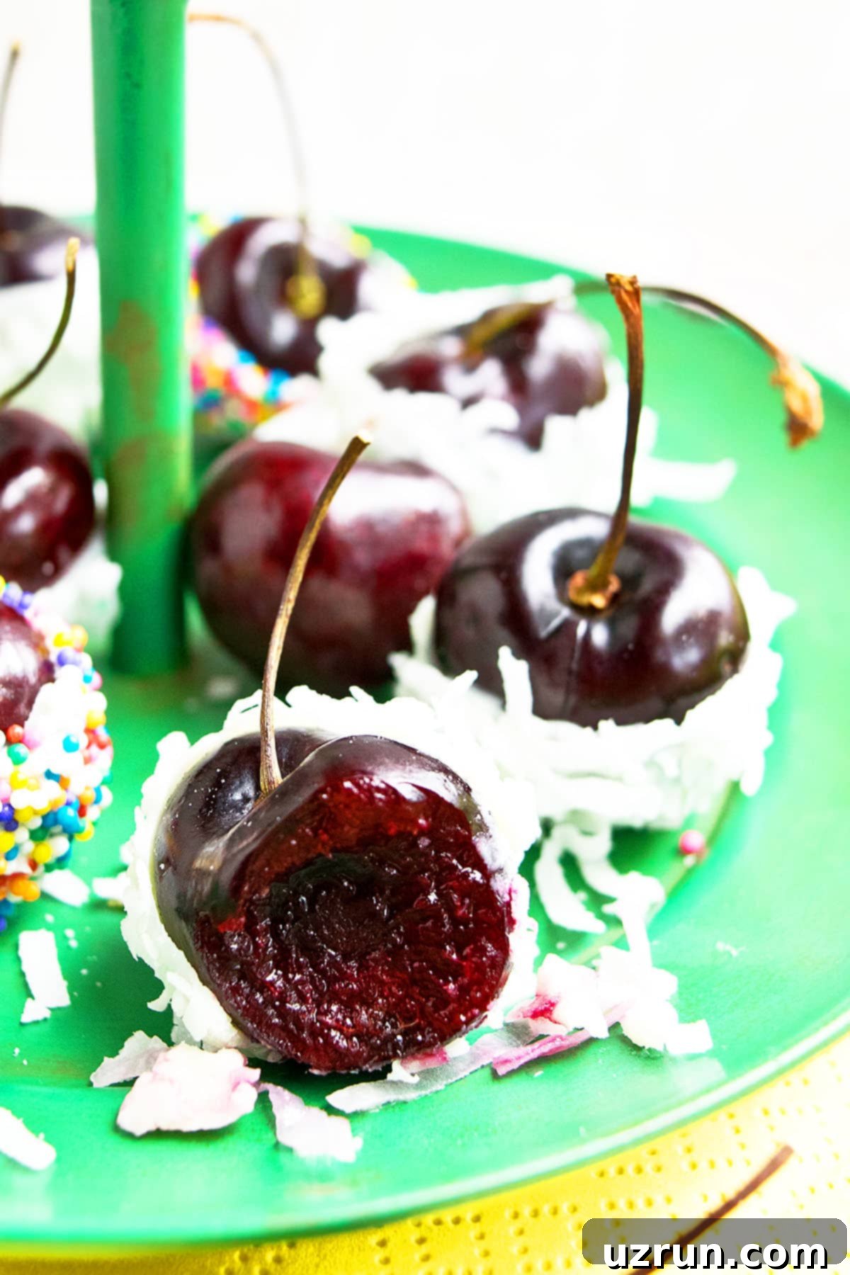 Chocolate Cherry Delights 4 Partially Eaten Cherry With White Chocolate and Coconut on Green Dish