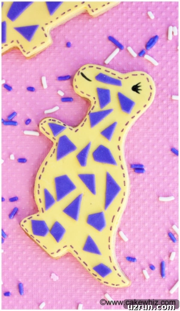 Easy Dinosaur Cookies on Pink Background With Sprunkles