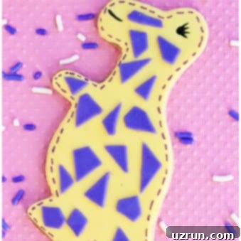 Roarsome Easy Dinosaur Cookies 6 Easy Dinosaur Cookies Decorated with Fondant on Pink Background