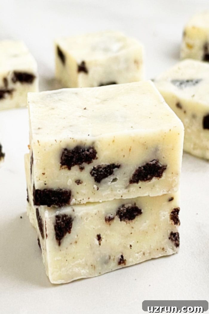 Stack of Easy Microwave Oreo Fudge (Cookies and Cream Fudge) on White Base